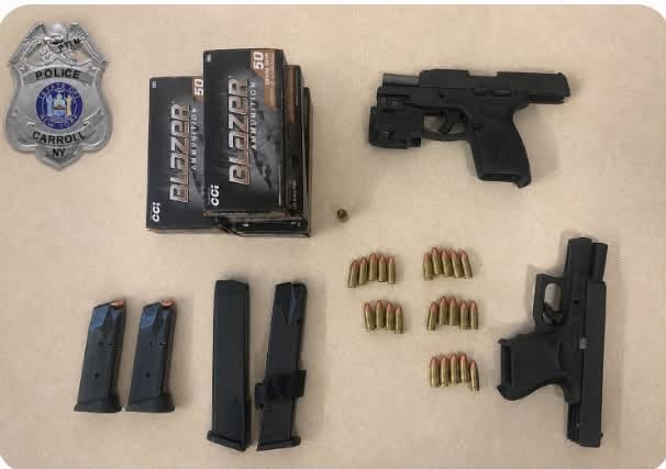 Two charged with possession of stolen guns in Carroll
